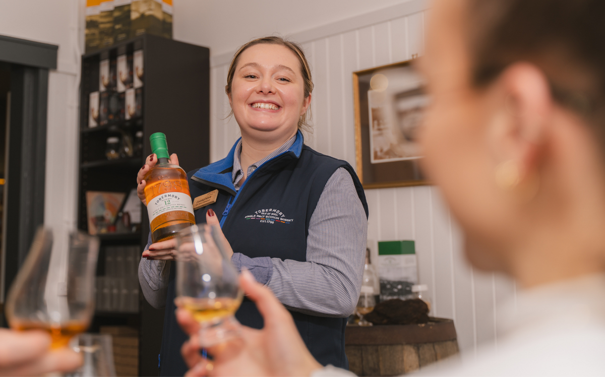 Tobermory Distillery Tour Guide is leading a whisky tasting.